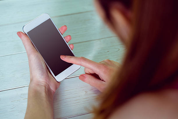 istock Casual woman using her smartphone 485047522