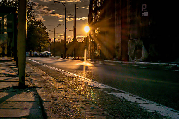 istock Sunny street road with scaffolding 485052892