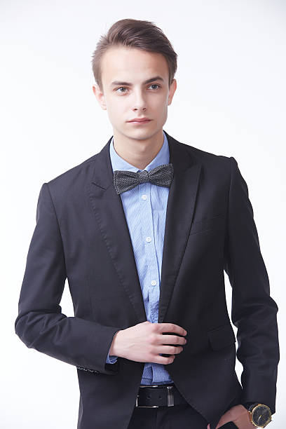 istock young handsome man in elegant suit with butterfly 485053228