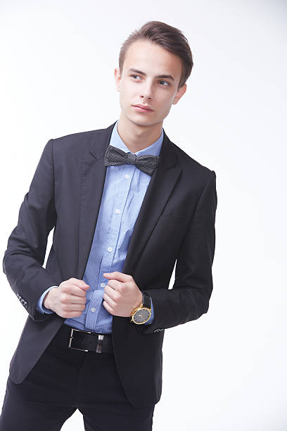 istock young handsome man in elegant suit with butterfly 485053236