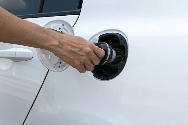 istock Hand opening the oil filler cap 485054424