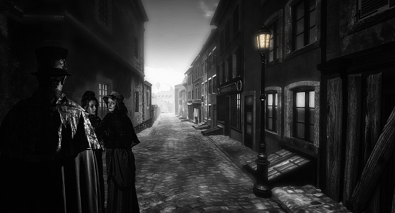 Hombre siguientes dos mujeres en una calle victoriana oscuro photo