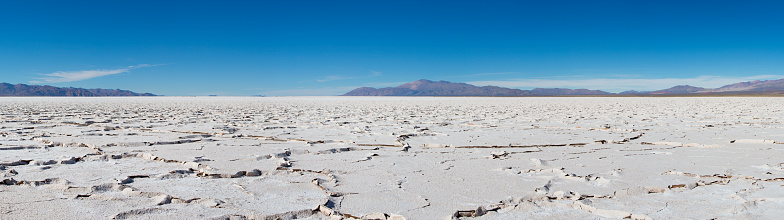 Panorama of a the Salinas Grande against a blue sky, a huge salt field in Jujuy Province, north of Argentina.
