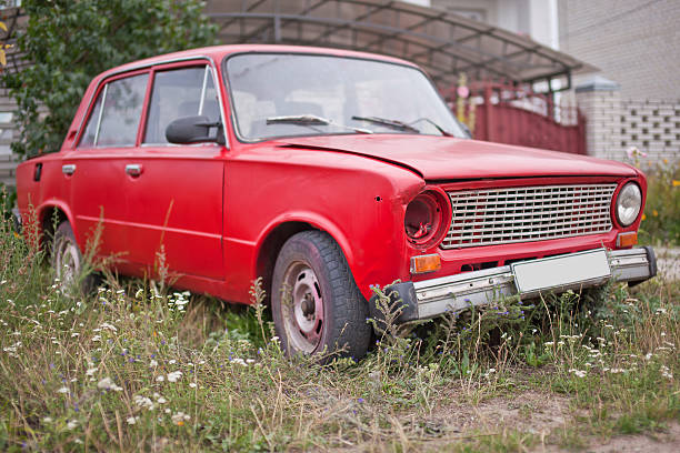 Side view of red old rusty car stock photo