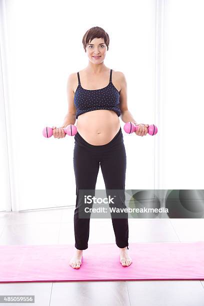 Pregnant Woman Keeping In Shape Stock Photo - Download Image Now - 2015, 40-44 Years, 40-49 Years