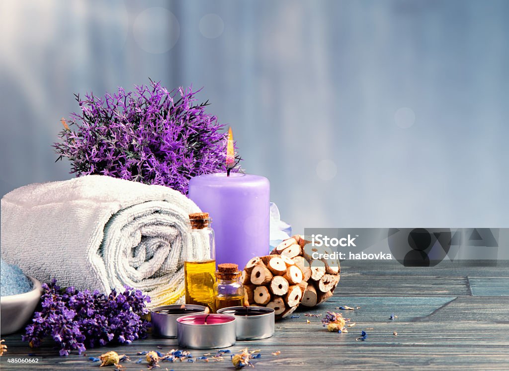 spa massage spa massage setting, product, oil on wooden background Purple Stock Photo