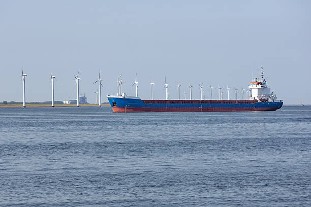 istock Dutch sea with cargo ship and wind turbines 485061228
