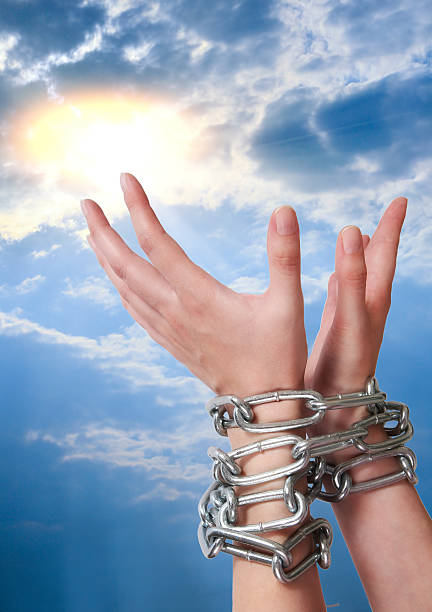 istock female hands tied by chain 485062206