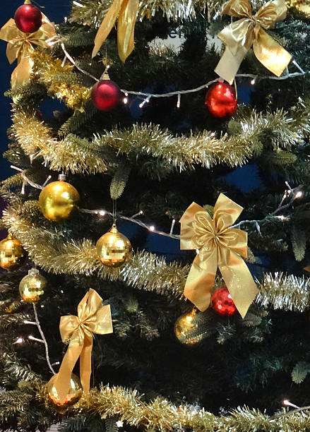 istock Image of Christmas tree with gold baubles, tinsel, bows, decorations 485065600