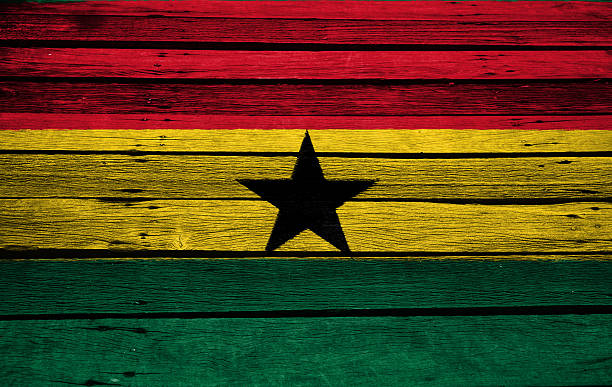 istock ghana flag on wood texture 485065874