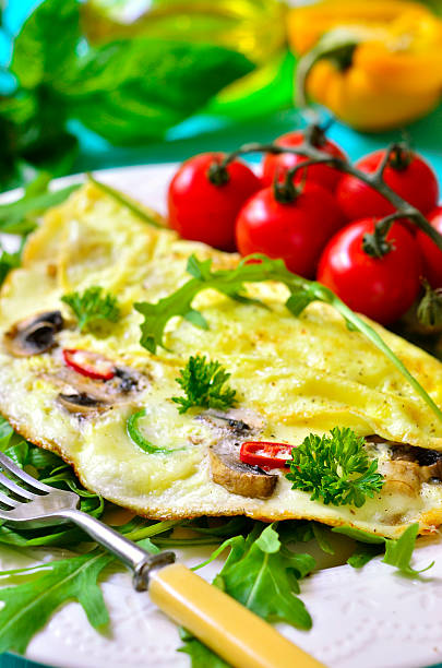 istock Omelet stuffed with champignon and cheese. 485066330