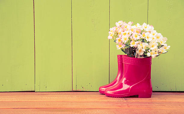 istock red color children boot and flower 485066742
