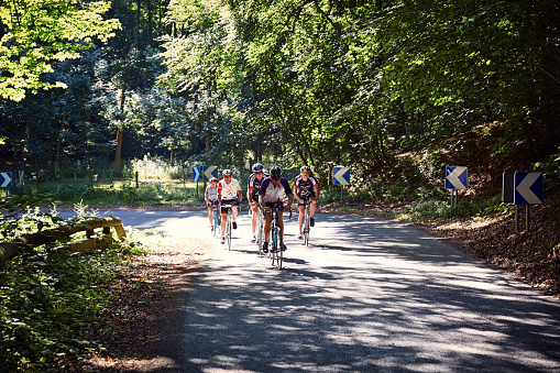 Rocamadour, France - June 19, 2015: Group of cyclists on French country road in the Dordogne
