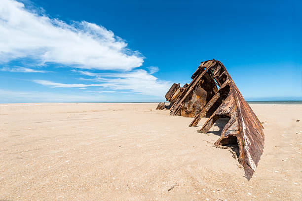 Famous Beach El Barco with rusty barge in Uruguay