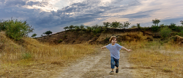 little boy running, outdoor