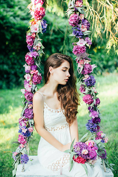 istock Beautiful young girl on a swing 485072672