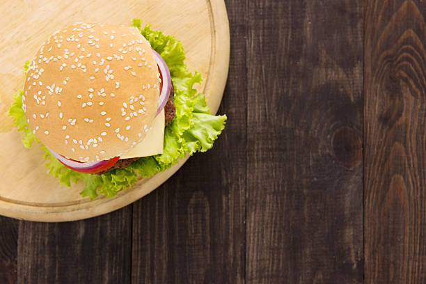 istock Top view bbq hamburger on the wooden background 485073472