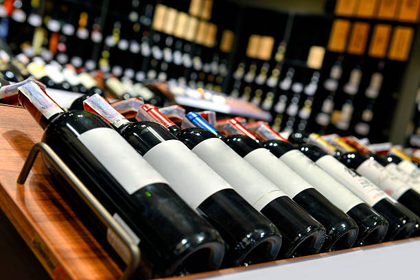 istock Red and white wine in bottles 485074369