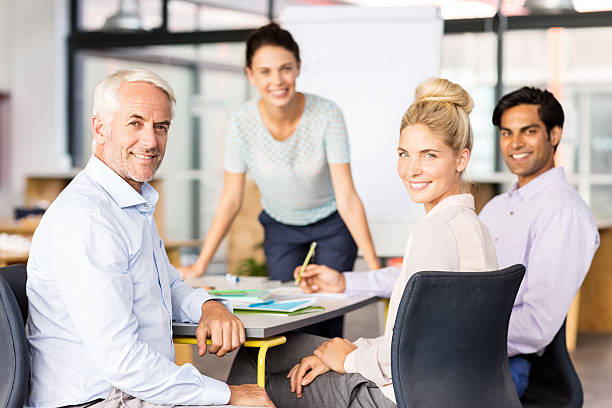 istock Smiling Business People In Board Room 485077132