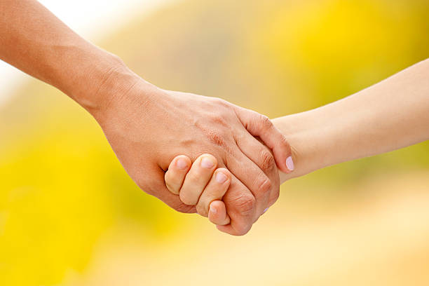 istock Mother holds a child's hand 485077404