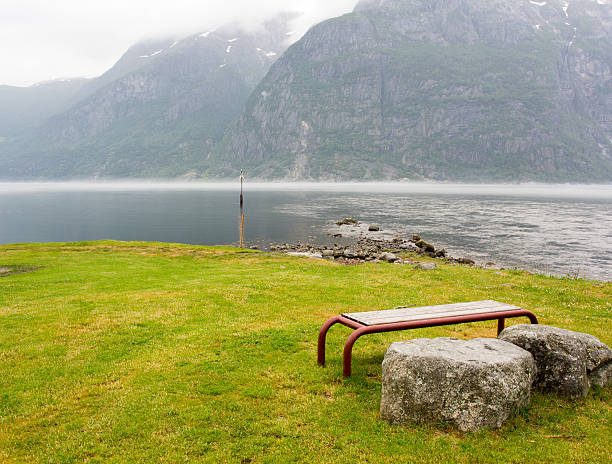 Bench at fjord stock photo