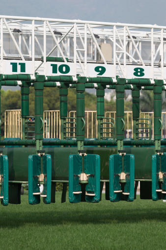 Close-up of the horse racing starting gate.