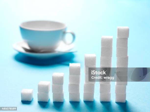 Sugar Growth With Sugar Cubes Stock Photo - Download Image Now - Bar Graph, Blue, Business