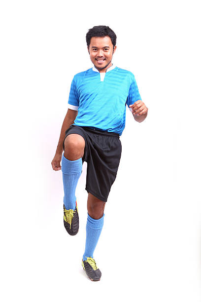 istock Young soccer football player on white 485079601