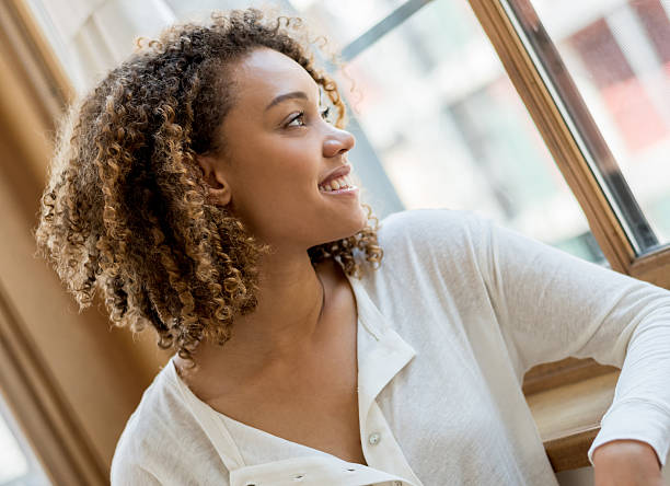 istock Woman at home looking throught the window 485080742