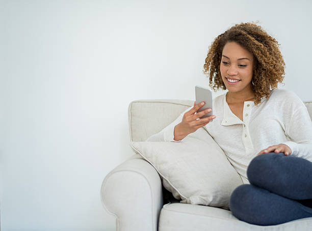 istock Woman at home texting on her phone 485082236