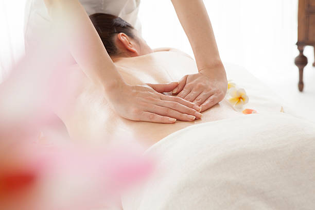 istock Beautiful young woman getting spa massage 485082634