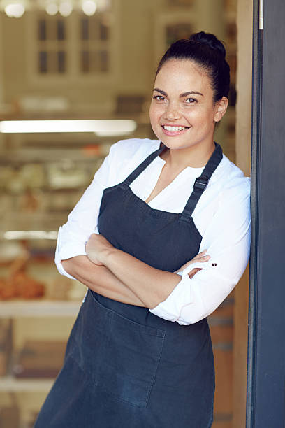 istock She's owner, manager and waitress all rolled into one! 485083730