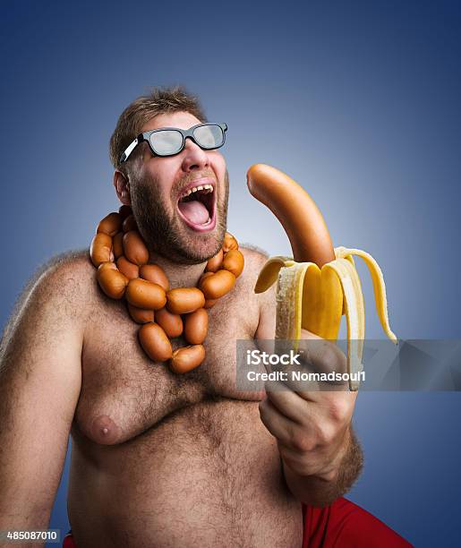 Strange Man With Sausages Stock Photo - Download Image Now - Bizarre, Men, Eating