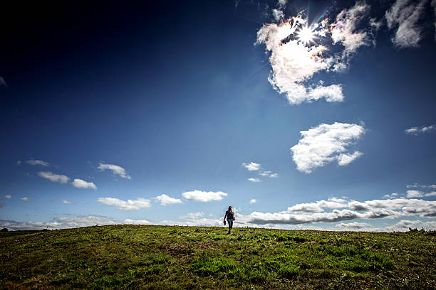 istock Mature woman walking in remote hillside 485087132