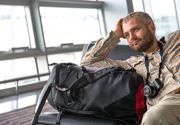 istock Smiling man at airport 485087304
