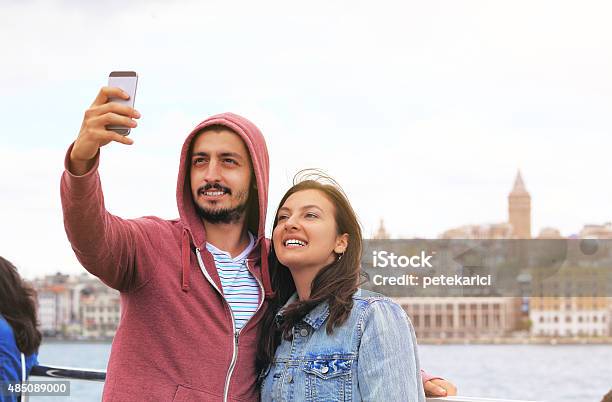 Young Couple Taking Selfie In Front Of Galata Tower Istanbul Stock Photo - Download Image Now