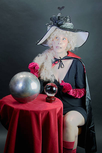 istock Female Witch Deciding On A Ball For Fortune Telling 485091940