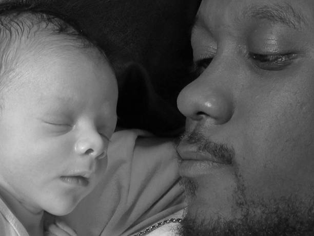 istock Father and Newborn Son, Black and White 485100742