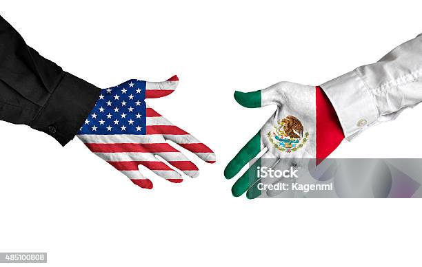 American And Mexican Leaders Shaking Hands On A Deal Agreement Stock Photo - Download Image Now