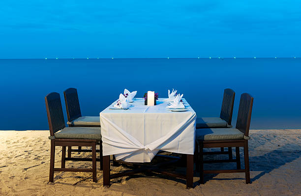 istock romantic dinner on the sea beach 485105660