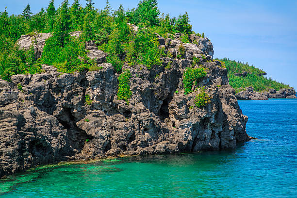 istock gorgeous landscape view with cliffs rocks above great Huron lake 485106068