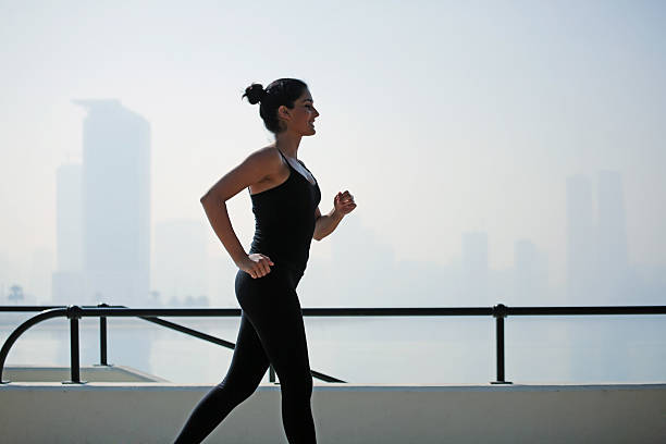 istock Runner woman excersizing in park over the cityscape 485107498