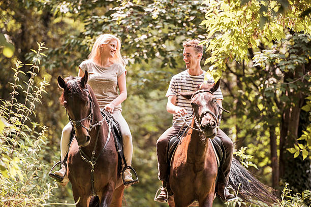 istock Couple horseback riding. 485111249
