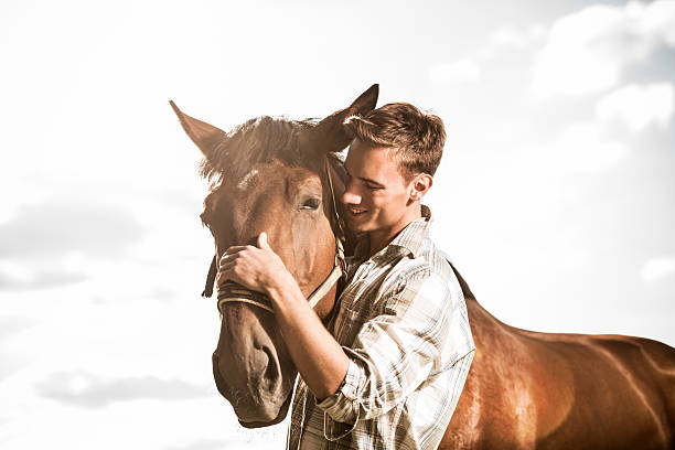 istock Man with horse against the sky. 485111285