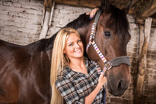 istock Young woman with her horse. 485111297