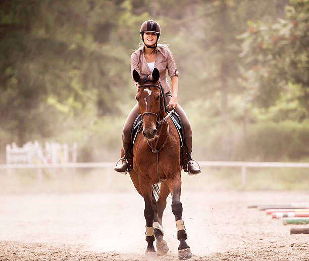 istock Woman horseback riding. 485111457