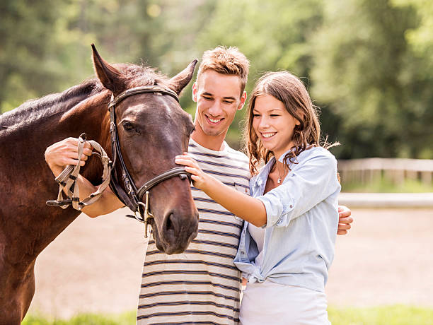 istock Young couple with their horse. 485111555