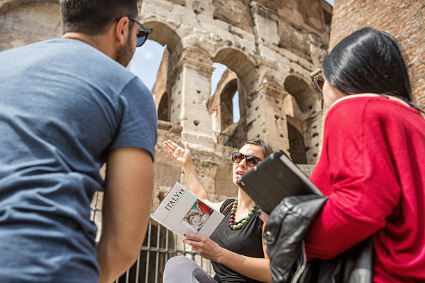 istock Tourists with a guide in front of the Coliseum, Rome 485112205