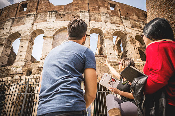 istock Tourists with a guide in front of the Coliseum, Rome 485112223