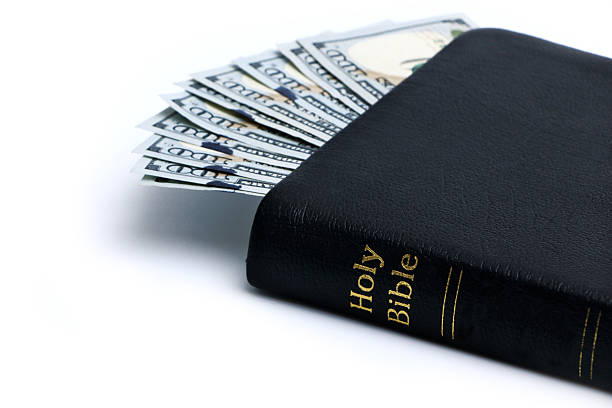 istock Money and Bible 485112946